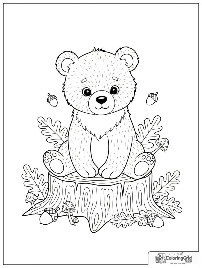 Bear cub sitting on a tree stump.