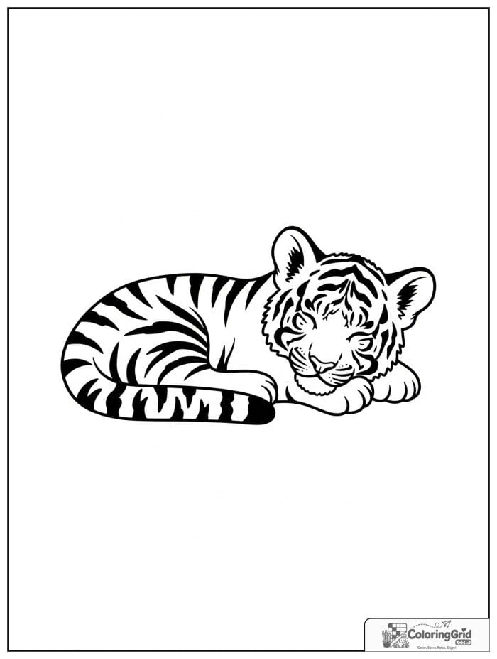 Sleeping tiger cub curled up peacefully.