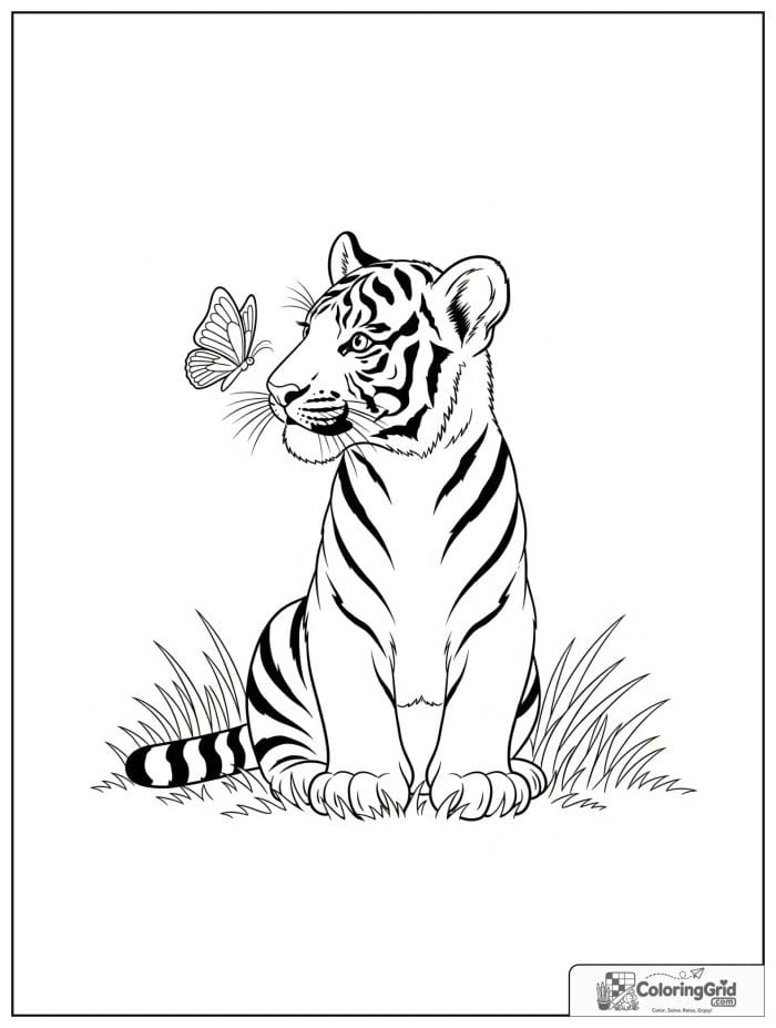 Tiger cub watching a butterfly.